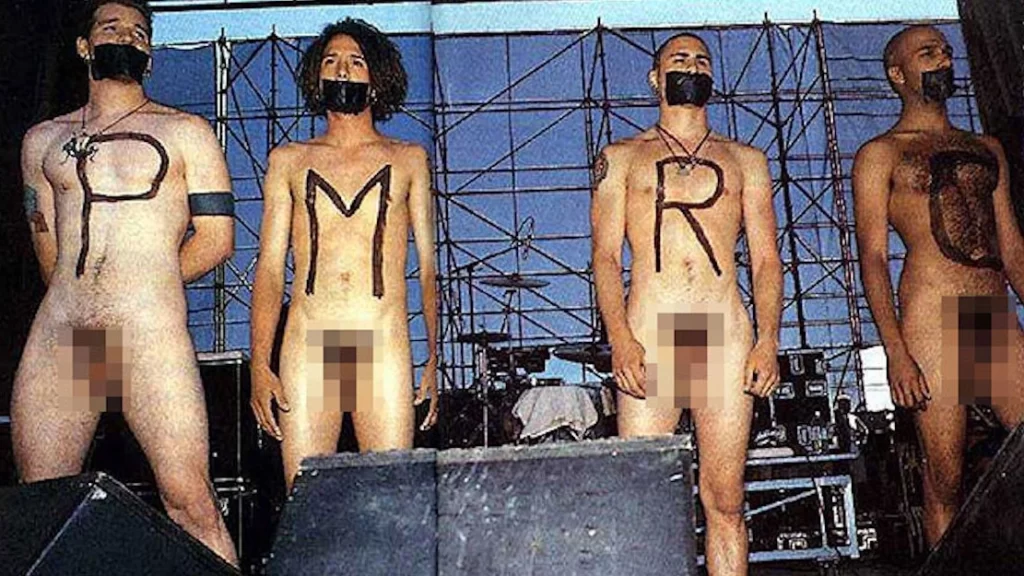 Rage Against the Machine, all four members, nude on stage with "P M R and C" painted on their chests